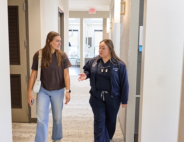 Patient walking with Dr. Teafatiller at Wright Naeger Dentistry