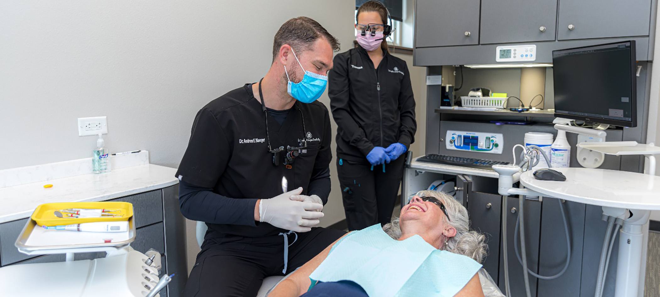Dr. Naeger interacting with happy patient