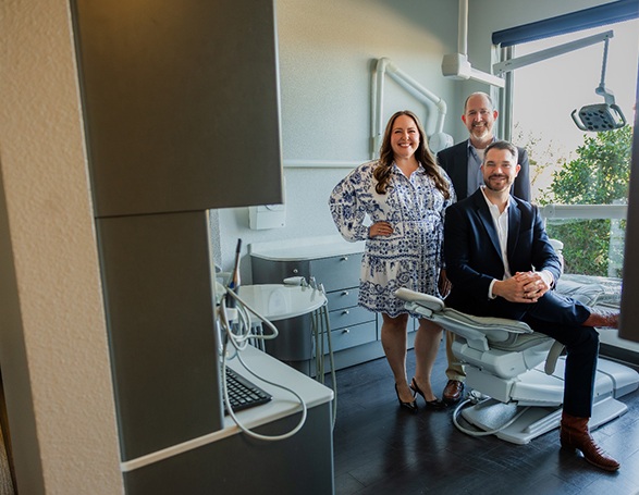 Group photo of dentists in their office in nice outfits