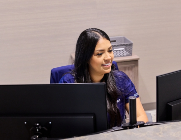 Woman smiling at her phone